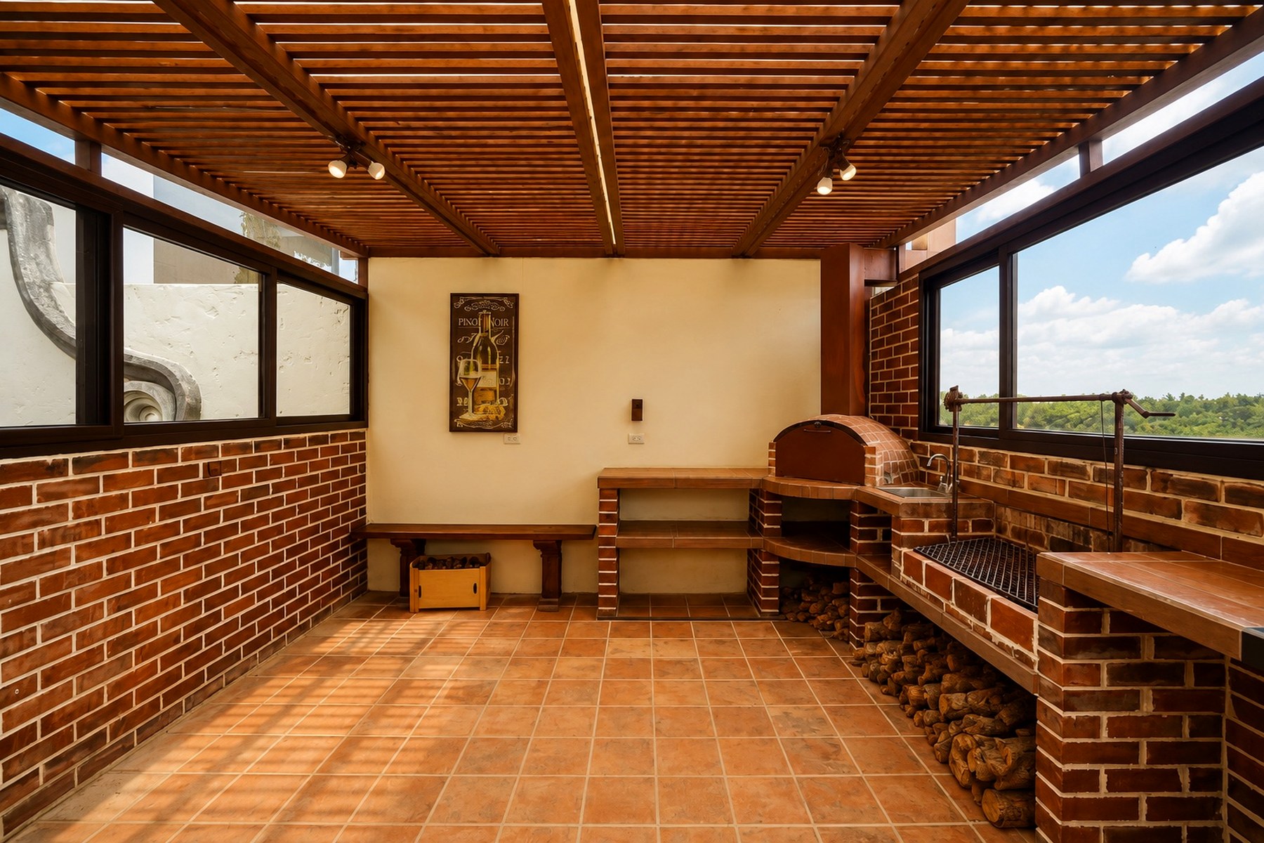 Área social con pérgola, horno para pizza y churrasquera